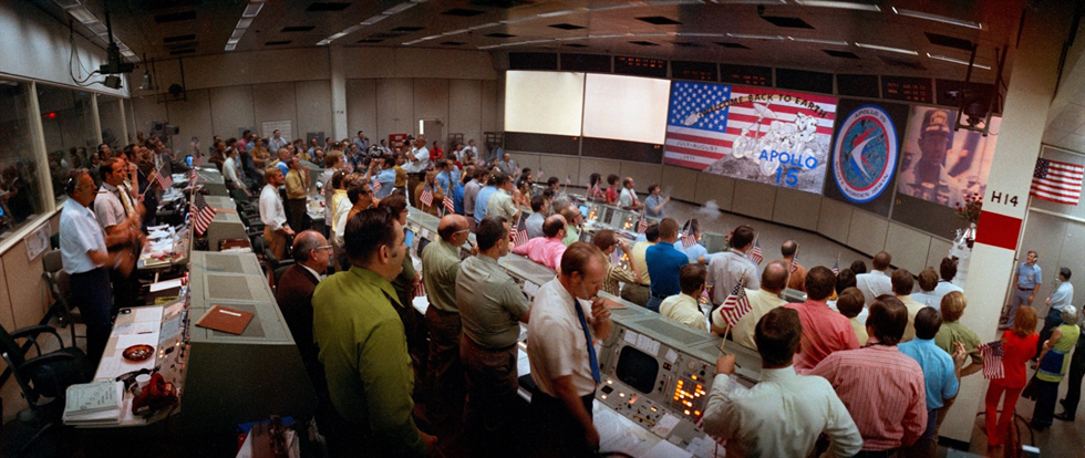 An overall, wide-angle lens view of activity in the Mission Operations Control Room in the Mission Control Center minutes after the launch of the Apollo 15 lunar landing mission. Ground elapsed time was 45 minutes and 42 seconds when this photograph was taken. Image Credit: NASA